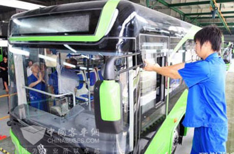 Workers assembly electric bus