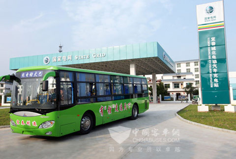 The pure electric city bus runs out of the recharging station