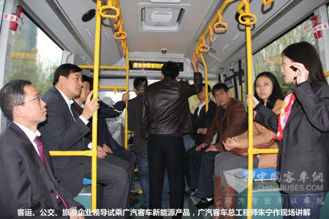 The leaders are taking on the bus while the engineer from GAC is introducing