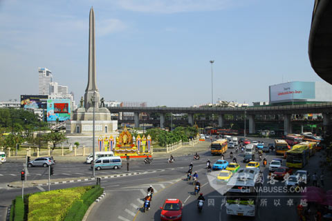 King Long CNG bus is driving in the street of Bangkok