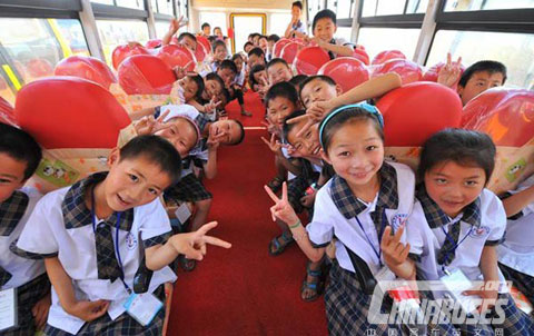 Children were excited to sit in their new spacious school bus.